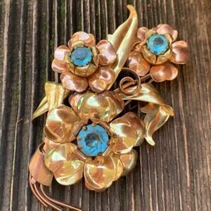 Vintage Copper and Brass Floral Brooch with Blue Rhinestones